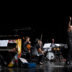 Sinfonia Casalinga; Serate musicali, Teatro Bruno Munari, Teatro del Buratto.Marcello Corti direttore
Carlotta Raponi, flauto traverso
Enrico Gabrielli, clarinetto basso
Yoko Morimyo, violino. Organizzatore: Silvio Oggioni
Sinfonia CasalingaCamillo Vittorio Lepido, violoncello
Maxine Gloria Rizzotto, pianoforte
Sebastiano De Gennaro, percussioni